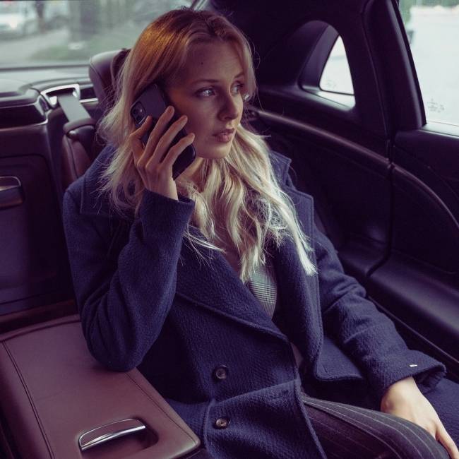 Professional chauffeur-driven luxury sedan for corporate travel in Seattle