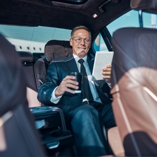 Professional chauffeur-driven luxury sedan for corporate travel in Seattle