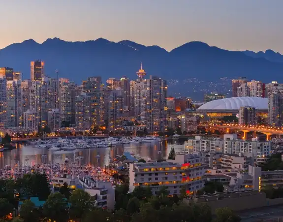 Vancouver City skyline with mountains in the background.